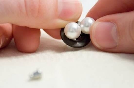 Keep earrings together in button while traveling